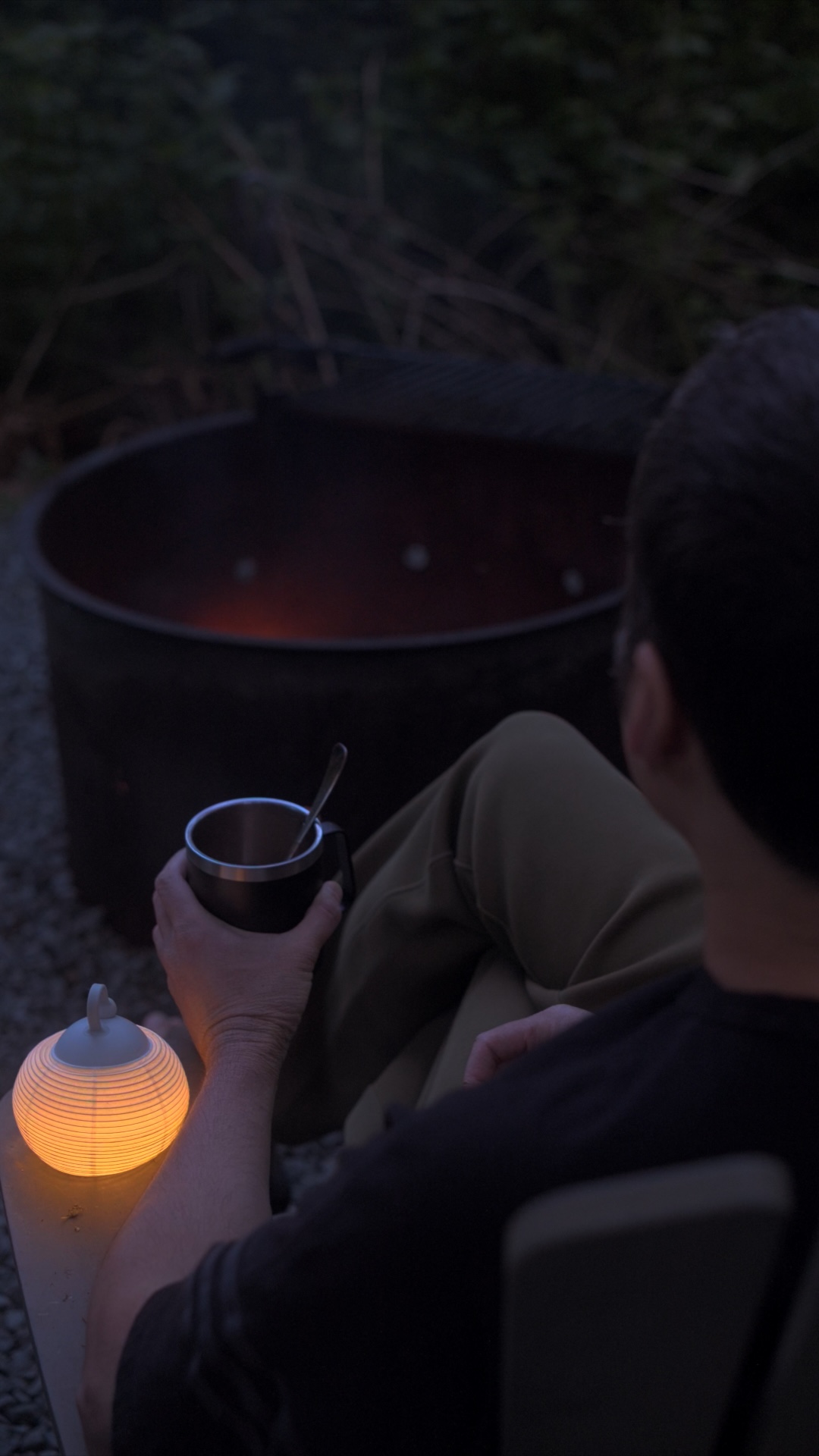 Sitting next to the campfire